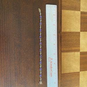 Gold, amethyst, and diamond tennis bracelet